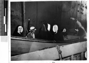 Man and six Nuns on a rescue boat, Solomon Islands, Oceania, February 27, 1943