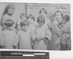 Sister Paula with orphans at Fushun, China, 1934