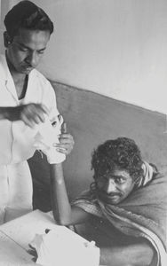 East Jeypore, Orissa, India. Staff Nurse Lemuel Raj placing a hand bandage at the Christian Hos
