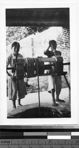 Drawing water from a well, Loting, China, ca. 1930