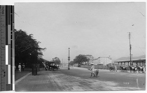 Street scene with automobile and rickshaws, Hong Kong, China, ca.1920