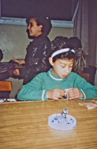 A girl at the evening meal at Fowlers orphanage 1992. It is difficult for the congregation to r