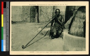 Grandmother smoking a long pipe, Sudan, ca.1920-1940