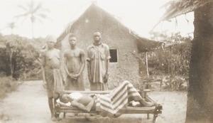 Patient lying on bench, Nigeria, ca. 1921