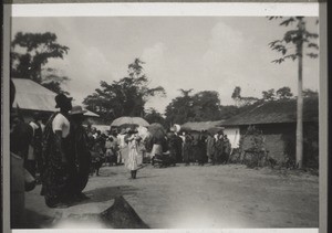 "The King of Mooso leaving after the mission anniversary festival (behind him his great drum)." (Photograph by Mrs Schäfer, 1929)