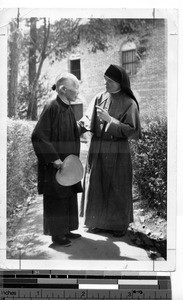 A Maryknoll Sister speaks with an elderly woman at Guilin, China, 1948