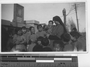 Sr. Scholastica with children at orphanage at Fushun, China 1937