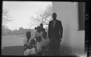 African people in front of a building, Mozambique, ca. 1940-1950