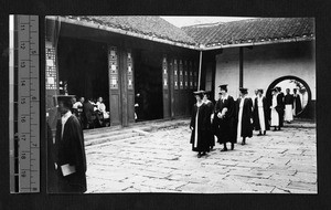 Faculty at Ginling walking in caps and gowns, Nanjing, Jiangsu, China, 1922