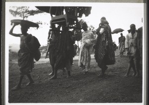 Chief coming to the festival with stool and insignia