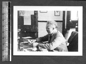 Gordon Agnew at desk, Chengdu, Sichuan, China, ca.1945-1946