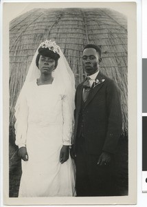 African bridal couple in front of a hut, South Africa