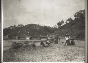 Chickens are carried two or three days' journey in bamboo baskets, to be sold in the town of Kayin. If the porters come to a river they put the baskets down in shallow water, so that the chickens do not die of thirst