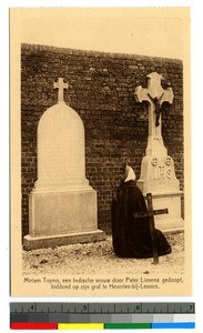 Miriam Topno praying at Father Lievens's grave, India, ca.1920-1940