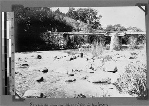 Wooden bridge leading over the Mbaka River, Nyasa, Tanzania, ca. 1898-1914