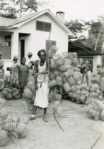 Leper holding baskets, in Ebeigne, Gabon