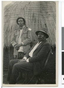 Two African men in front of a hut, South Africa