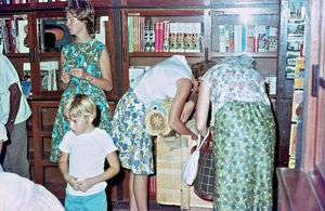 DMS Bookshop, Crate, Aden 1966 in the background ses accountant Grethe Nørgaard Pedersen, 1966