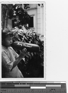 An orphan with a Christmas message at Luoding, China, 1936