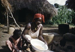 Woman and girl in the outdoor kitchen, Banyo, Adamaoua, Cameroon, 1953-1968