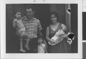 Family in front of home