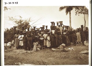 Children carrying loads on their heads