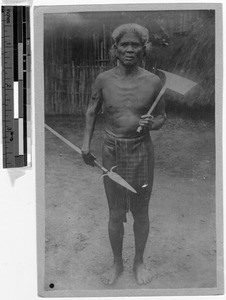 Full length portrait of man carrying weapons, Northern Luzon, Philippines, ca. 1914