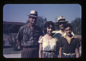 L. Haven Miller, right rear, with a man and two teenaged children