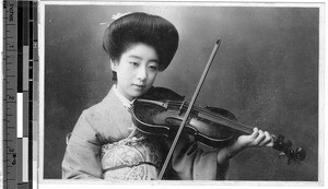 Portrait of a young Japanese woman playing the violin, Japan, ca. 1930-1950