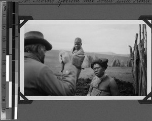 Brother Moths is talking to a woman and a child (near Tabase), South Africa East, 1933-12-17