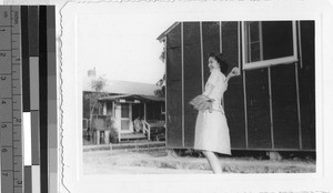 Woman throwing softball, Jerome Relocation Center, Denson, Arkansas, ca. 1942