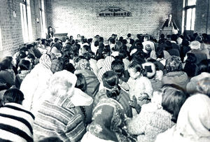 Church service of a Nepali congregation, Kathmandu, according to tradition sitting on the floor