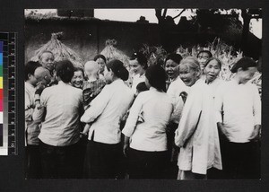 Missionary wife with mothers and babies, China, ca. 1930