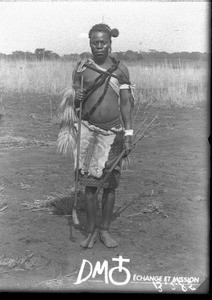 African man dressed as a warrior, Makulane, Mozambique, ca. 1896-1911