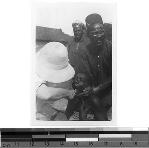 Sister Anne doing a difficult job, Mbozi, Tanzania, 1935