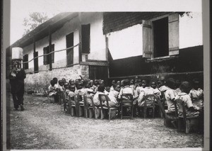 A Junior School class in Akropong doing hand-work (plaiting palm-leaves and fibres)