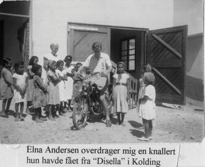 Missionary Elna Andersen (DMS) hand over a motorbike, which was given as donation by "Disella"