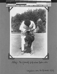 Missionary Giersch extracts a tooth, Mbozi, Tanzania, ca.1906-1929