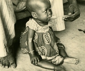 Girl with her dad, in Ebeigne, Gabon