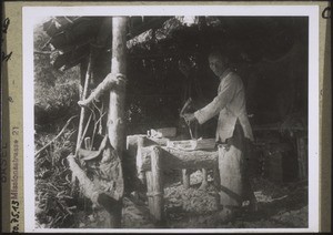 People making water scoops. Such people set up their huts in the forest, fell the tree appropriate for their work, and make wood scoops with simple tools