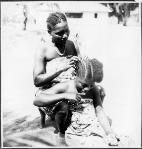 Women dressing their hair, Pare, Tanzania, ca.1927-1938