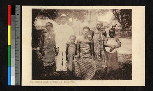 Catechist standing with wife and children, Congo, ca.1932