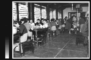 Students eating in dining hall, Women's College, Yenching University, Beijing, China, 1941