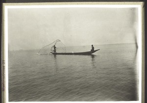 Fisherman throwing out his net