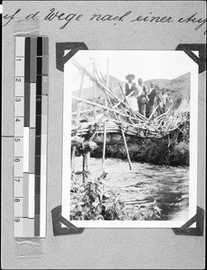 Men standing on a bridge, Nyasa, Tanzania, 1936