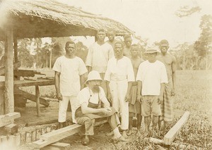 M. Tanner with his workers, in Gabon