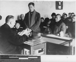 Fr. Quirk talking to Christians at Fushun, China, 1940