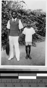 Two boys standing next to each other, Africa, April 1949