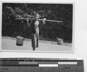 A Chinese water boy at Wuzhou, China