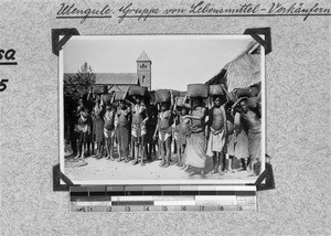 Female and male food vendors, Utengule, Tanzania, 1913